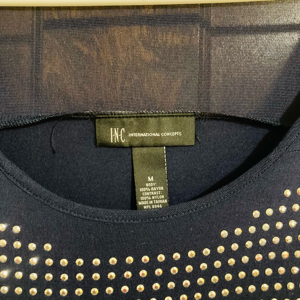 Navy shear and studded shear top.